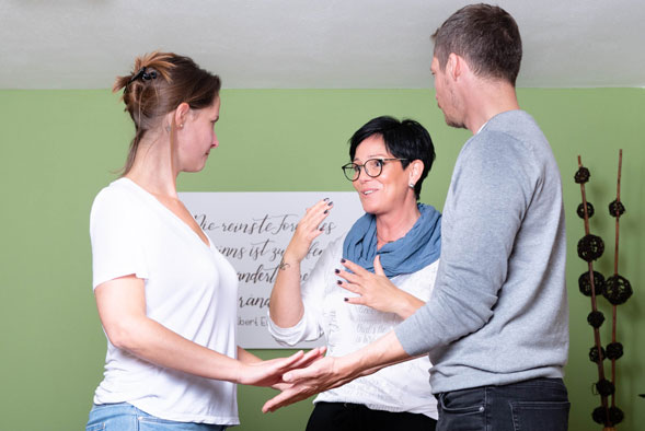 Systemic circle constellation session holding hands